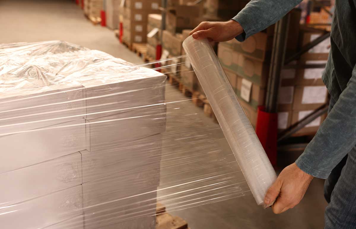 Stretch wrapping boxes for shipping and warehouse operations
